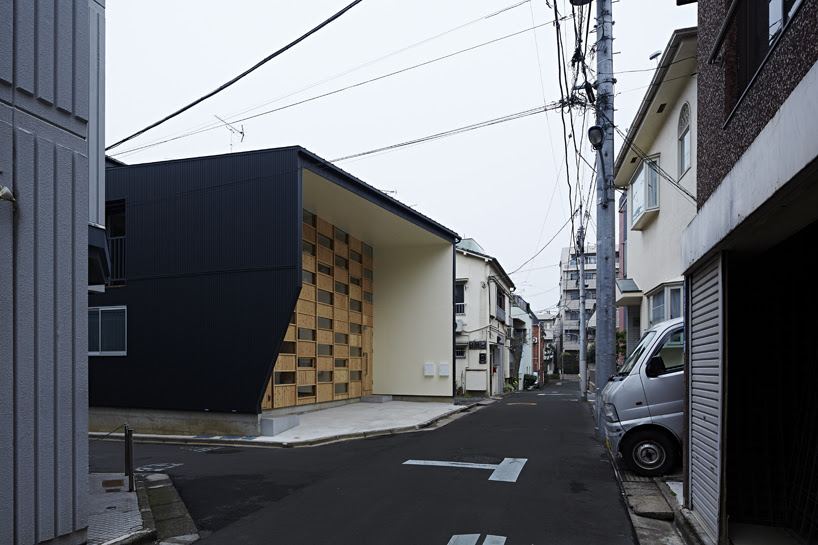 takeshi shikauchi's checkered house brings wood back to urban japan