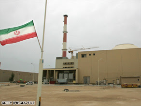 An Iranian flag flies outside the building containing the reactor of Bushehr nuclear power plant, south of Tehran.