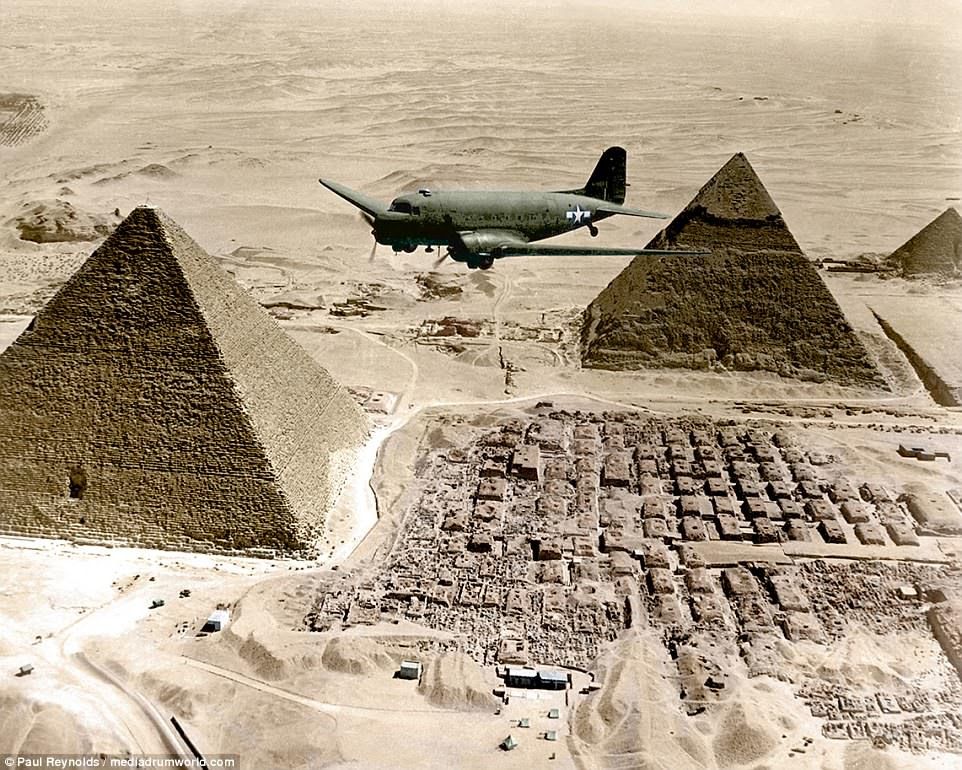 A C-47 Air Transport Command plane flies over the pyramids in Egypt loaded with urgent war supplies and materials. It was one of a fleet flying shipments from the U.S. across the Atlantic and the continent of Africa to strategic battle zones in 1943
