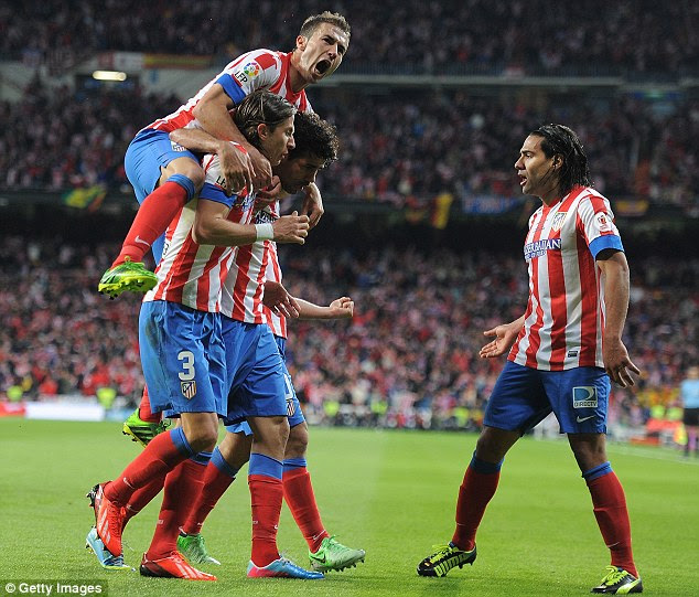 Equaliser: Atletico celebrate their opening goal in the Copa del Rey final against Real