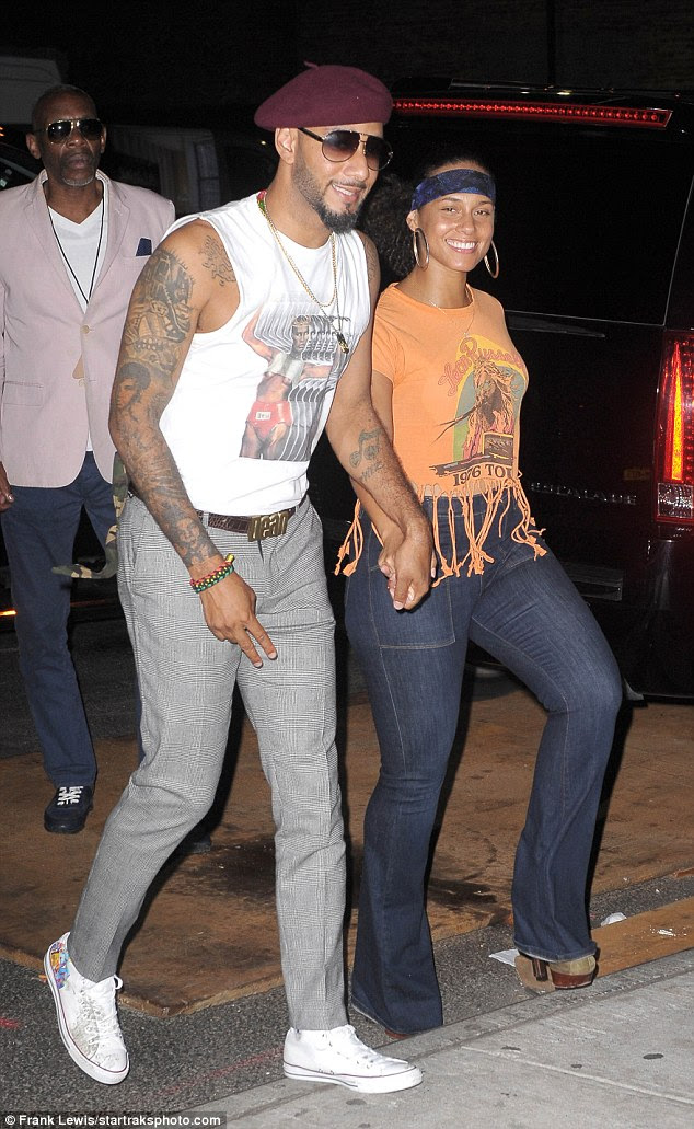 Giddy: The couple looked delighted to be out partying