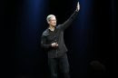Apple Inc. CEO Tim Cook waves to the crowd during the Apple Worldwide Developers Conference (WWDC) 2013 in San Francisco, California June 10, 2013. REUTERS/Stephen Lam