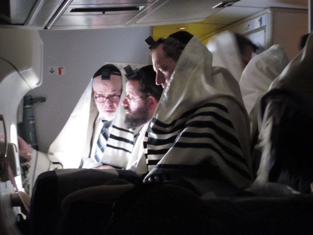 Image result for orthodox jews praying on a plane