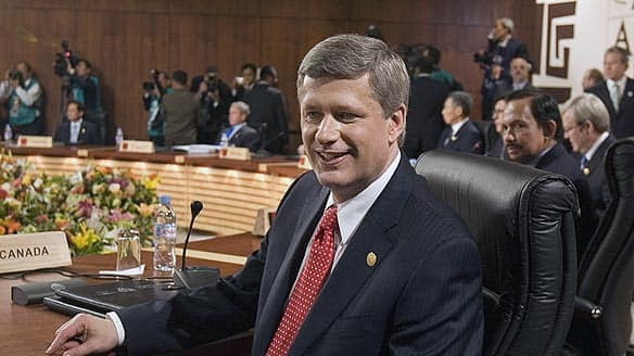 Prime Minister Stephen Harper takes his seat at the Asia-Pacific Economic Cooperation summit in Lima, Peru, on Saturday.