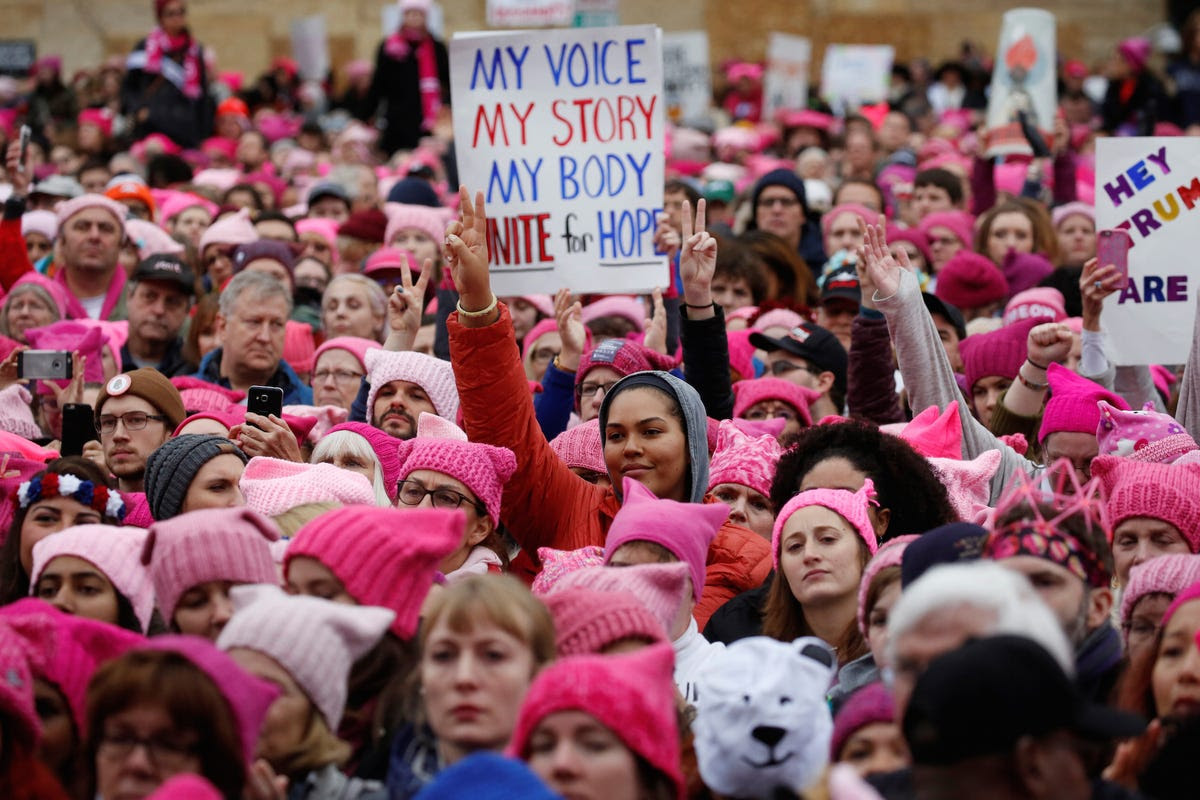 A pink knitted beanie, known as the "pussy hat," became a symbol of solidarity among protestors. Knitting parties organized in the weeks before the march.