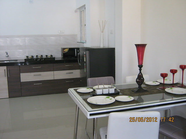 Dining cum kitchen in the show flat - Visit Gagan Akanksha, 1 BHK 1.5 BHK & 2 BHK Flats near Prayagdham, at Koregaon Mul, Uruli Kanchan, off Pune Solapur Highway, Pune 412202