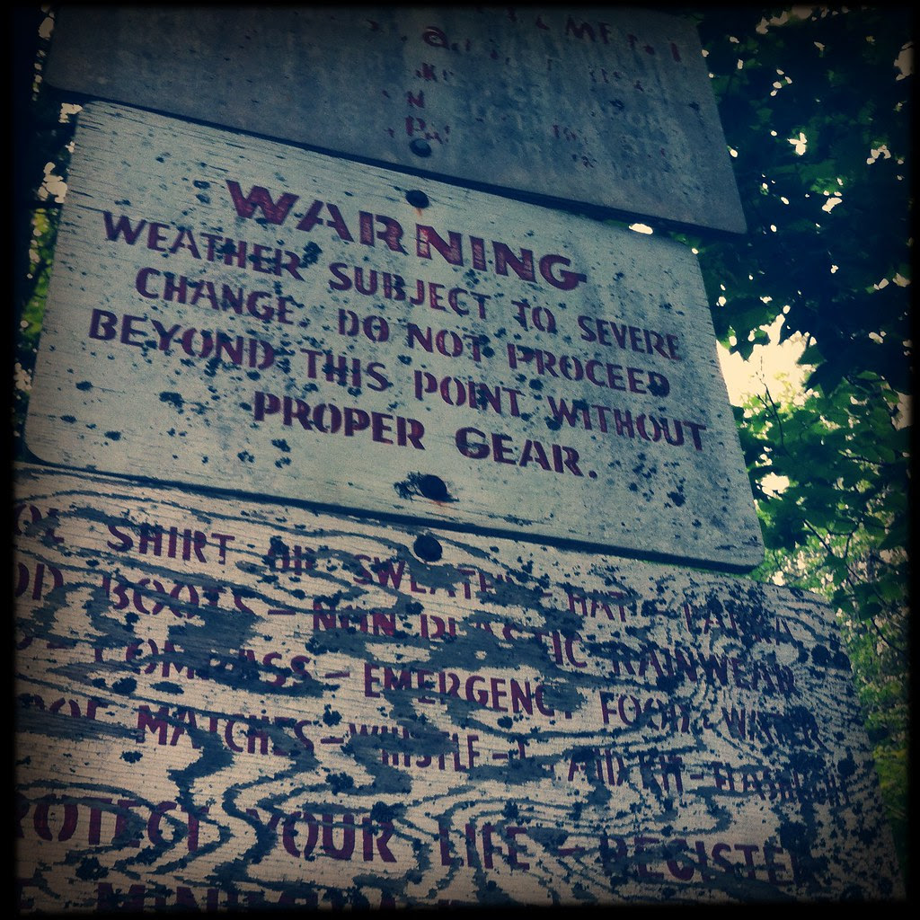 warning signs at upper works trailhead