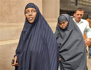 Two Somalian-American women, Amina Farah Ali and Hawo Mohamed Hassan, have been charged with providing money to Al-Shabaab from Somalia. Ali has now been charged with contempt of court and jailed for refusing stand for the judge. by Pan-African News Wire File Photos