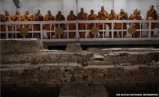 Thai monks inside the Maya Devi Temple meditate over the remains of the oldest Buddhist shrine in the world