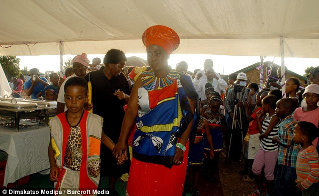 The couple pose in traditional costume. The £1,500 cost of the wedding included £500 for the bride