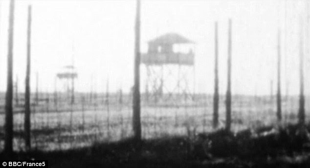 High security: The camp was surrounded by two lines of barbed wire and with lookout towers and flashlights used to guard the perimeter