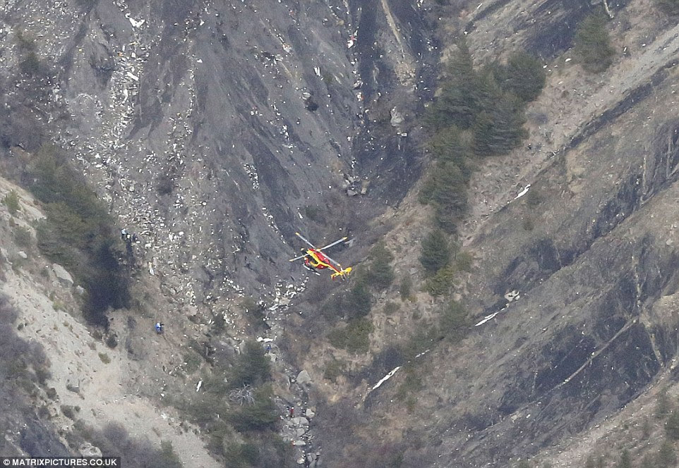 Disaster: A rescue helicopter flies over wreckage of a Germanwings Airbus A320 plane that crashed between the towns of Barcelonnette and Digne in the French Alps. All 150 people on board - including two babies and 16 children from the same German school - are presumed dead