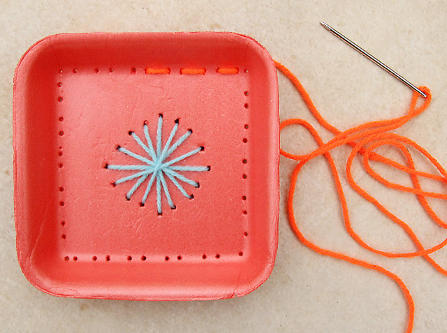 Embroidery on recycled Styrofoam trays