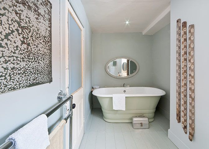 Bath is painted in Farrow and Ball Vert de Terre, the floor and walls in Light Blue