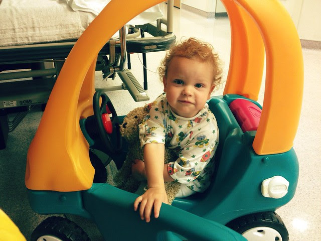 Lewis in his hospital gown and his hospital car