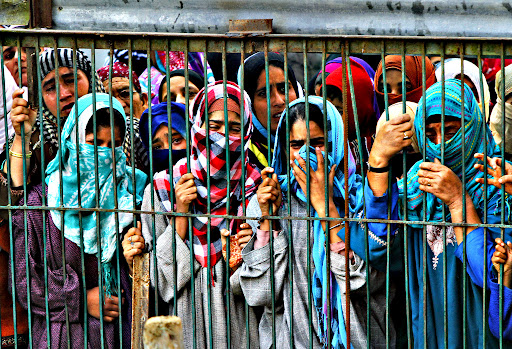 Kashmiri Muslim women wail as they watch the funeral procession of suspected rebels, at Barhama, 40 kilometers (25 miles) south of Srinagar, Indian controlled Kashmir, Monday, Oct. 5, 2015. At least four Indian army soldiers and three suspected rebels were killed in three separated gun battles in Indian-controlled Kashmir, police said on Monday