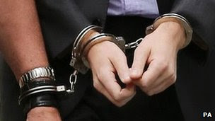 Handcuffs on suspect in UK - file pic