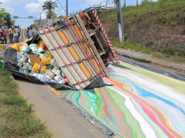 Truck With 14 Tons Of Paint Rolls Over Painting The Road In Vibrant Colors Truck With 14 Tons Of Paint Rolls Over Painting The Road In Vibrant Colors