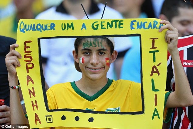 On the box: A spectator enjoys the party atmosphere in Fortaleza