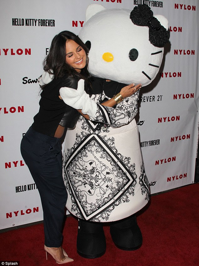 Warm reception: Former American Idol contestant Pia Toscano received a hug from the Hello Kitty mascot