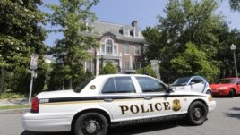 A U.S. Secret Service police car passes by the Syrian Embassy in Washington