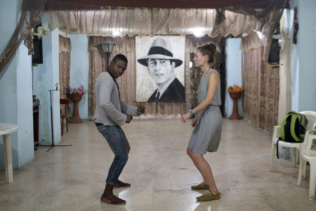Salsa dance instructor Ariel Domninguez gives a lesson of Cuban-style salsa to a student.