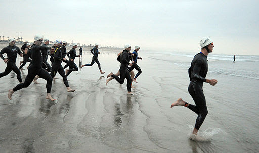 US Navy 090329-N-2959L-169 Athletes race to the water to begin the swim portion of the 31st annual Superfrog Triathlon at Silver Strand State Beach