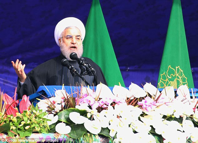 Iranian President Hassan Rouhani (above) speaks during a ceremony in Tehran to commemorate the 38th anniversary of Iran's Islamic fundamentalist revolution on February 10