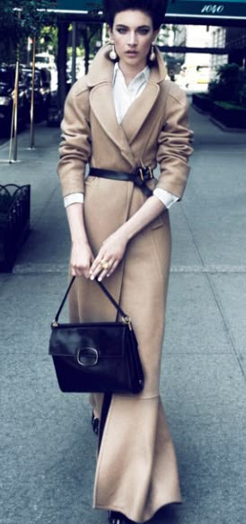 an elongated twist on a classic: notch-collar, wool, camel maxi coat with black leather belt at waist ... elegantly stated