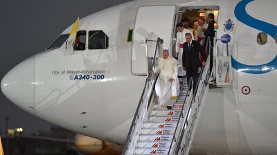 Pope Francis disembarks from the plane upon his arrival at the airport in Manila, Philippines, on Wednesday. In comments to reporters aboard the plane, Francis said though the attack on Charlie Hebdo magazine was an "aberration," free speech "cannot make provocations," especially against people's faith. Pope Francis disembarks from the plane upon his arrival at the airport in Manila, Philippines, on Wednesday. In comments to reporters aboard the plane, Francis said though the attack on Charlie Hebdo magazine was an "aberration," free speech "cannot make provocations," especially against people's faith.