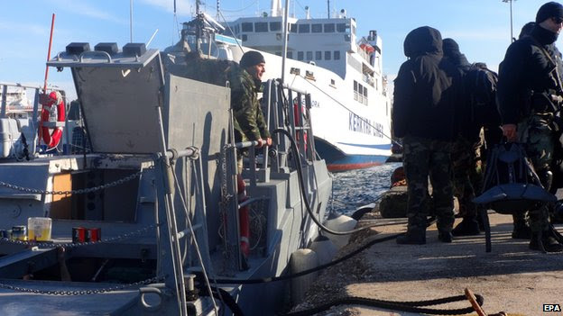 Armed special missions officers of the Greek coast guard set off from Corfu harbour for waters off the Ionian island of Othoni, responding to a distress signal from Moldovan-registered freighter "Blue Sky M" in the area, in Corfu, Greece, 30 December 2014