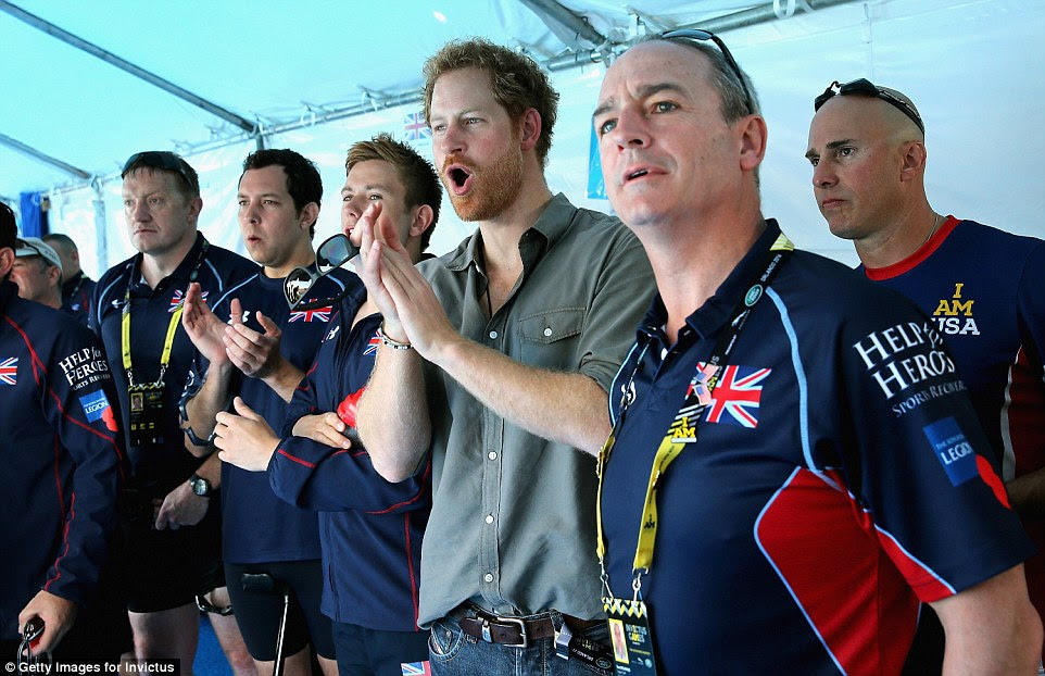 During the exhilerating event the prince could be seen cheering on his team aside their coaches