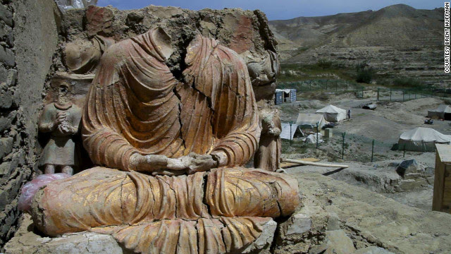 A Buddhist statue overlooks a Chinese government-owned mining compound in Logar province, Afghanistan. Mes Aynak, a 2,600-year-old Buddhist site, could be destroyed in December to create a massive copper mine.