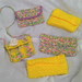 .a bunch of little crocheted bags