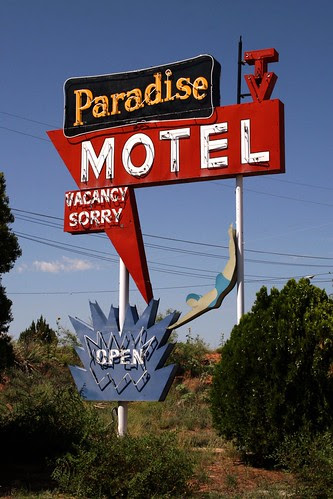 the paradise motel neon sign