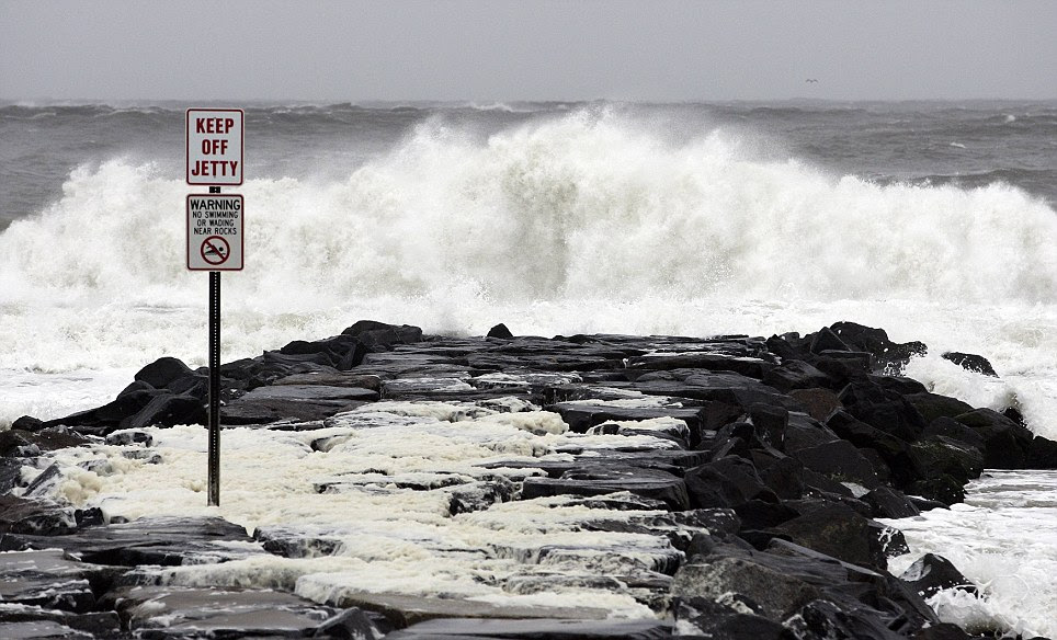 Storm approaches: Crashing waves created by Hurricane Sandy pictured in New Jersey hours before the full brunt of the storm hits today