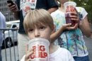 Benjamin Lesczynski takes a sip of a "Big Gulp" while protesting the proposed "soda-ban," that New York City Mayor Bloomberg has suggested, outside City Hall in New York