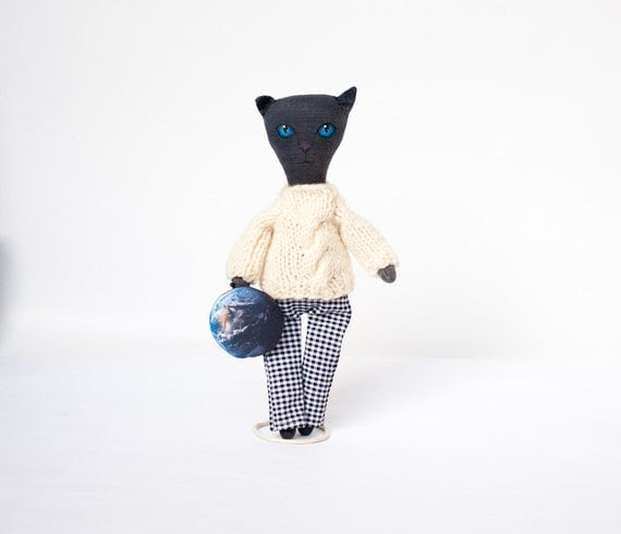 Black doll cat with Earth, primitive doll, cosmic cat with blue eyes