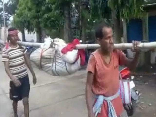 Image result for orissa man carries his dead wife on his shoulder