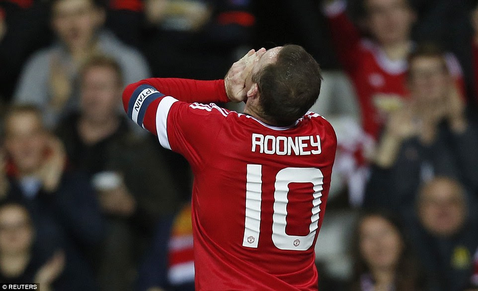 Wayne Rooney looks to the sky and celebrates as he opens the scoring against Ipswich at Old Trafford