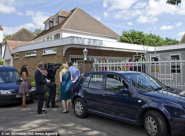 Media interest: Press outside the home of Rolf Harris in Bray, Berkshire, today, after the CPS announced the charges against him