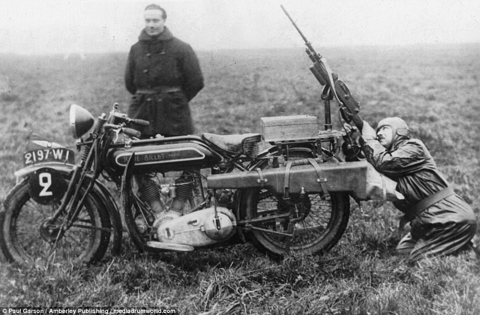 A French soldier in the 1920s uses a machine gun mounted on the back of a bike during a practice exercise