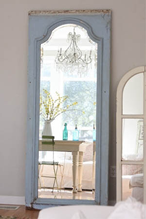 old door frame used as standing mirror