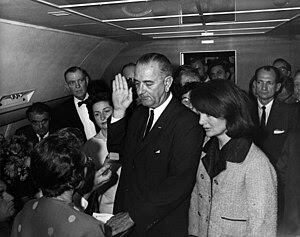 Lyndon B. Johnson taking the oath of office on... Lyndon B. Johnson taking the oath of office on...