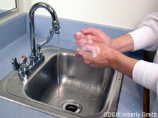 Photograph of a female washing her hands