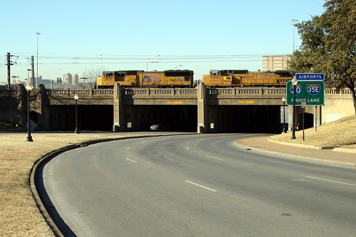triple underpass with train running on overpass