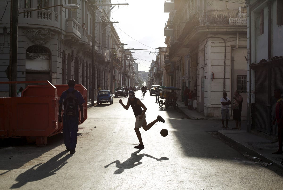 Soccer games are played everywhere, even in the street.