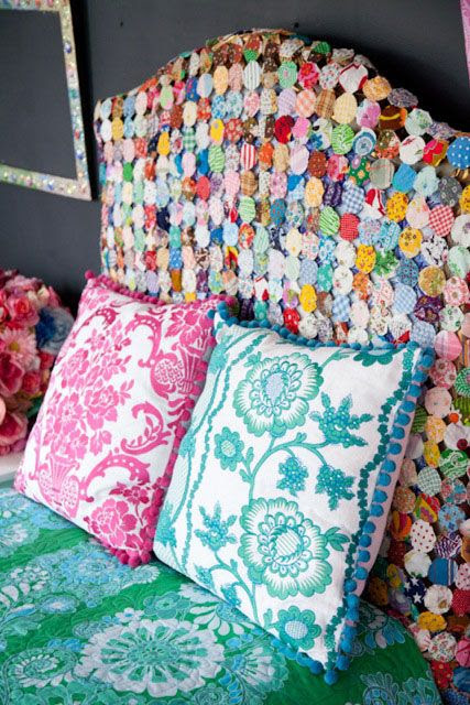 Mom currently has her yoyo quilt hanging on the headboard of the 'girl' guest room. It's damaged, and missing chunks, so this way she can display it without risking it being messed with.