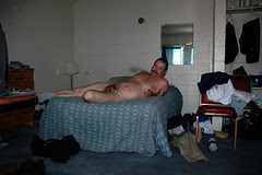 man nude reclining on bed