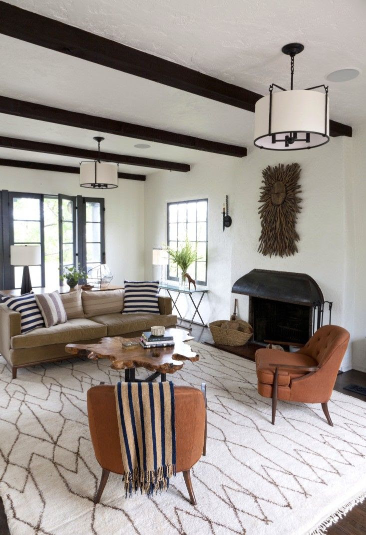 (BrandonRugs.com) A vintage Moroccan carpet provides a neutral base to the earthy tones of the room.